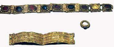 The treasure of Rhayader;  one gold ring set with onyx and engraved on the setting an ant, a portion of a gold necklet of nine pieces (eight links set with stones and one stone with the link missing), one piece of gold scroll, a small piece of embossed gold (both forming part of the necklet) and a gold armlet in four pieces.